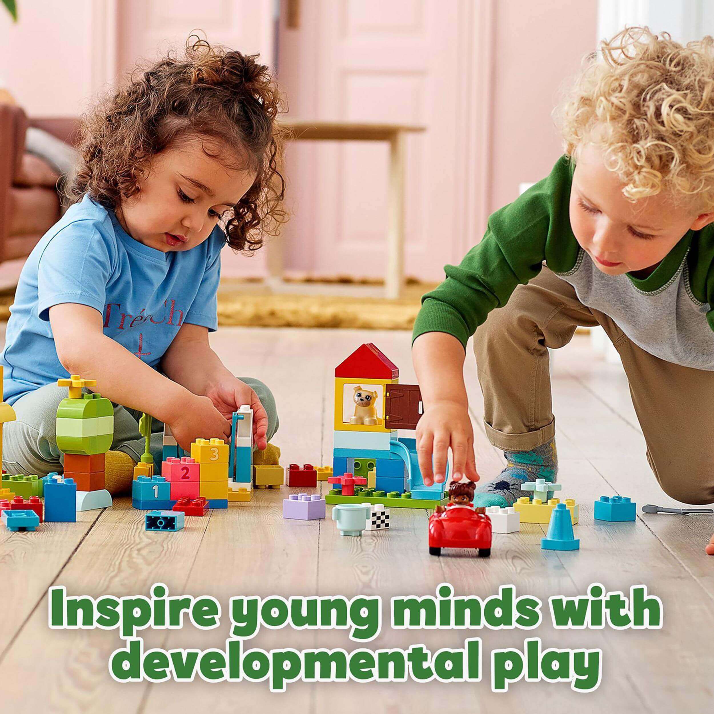 Two toddlers playing with LEGO® DUPLO bricks, inspiring creativity and developmental play.