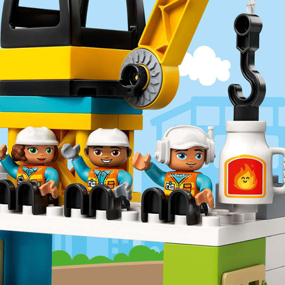 LEGO DUPLO construction set with three diverse character figures at a tower crane site.