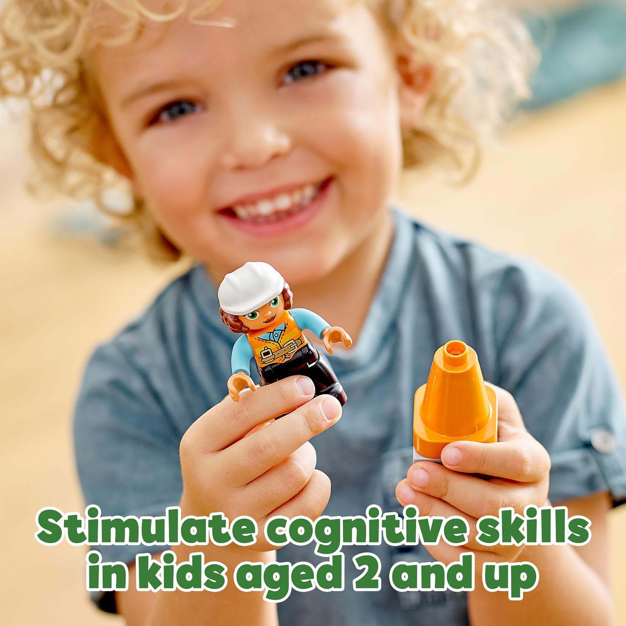 Child playing with LEGO® DUPLO figure and cone, enhancing cognitive skills for kids aged 2 and up.