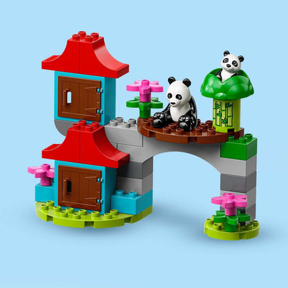 LEGO® DUPLO Town World Animals playset featuring two pandas and a colorful buildable environment with flowers.