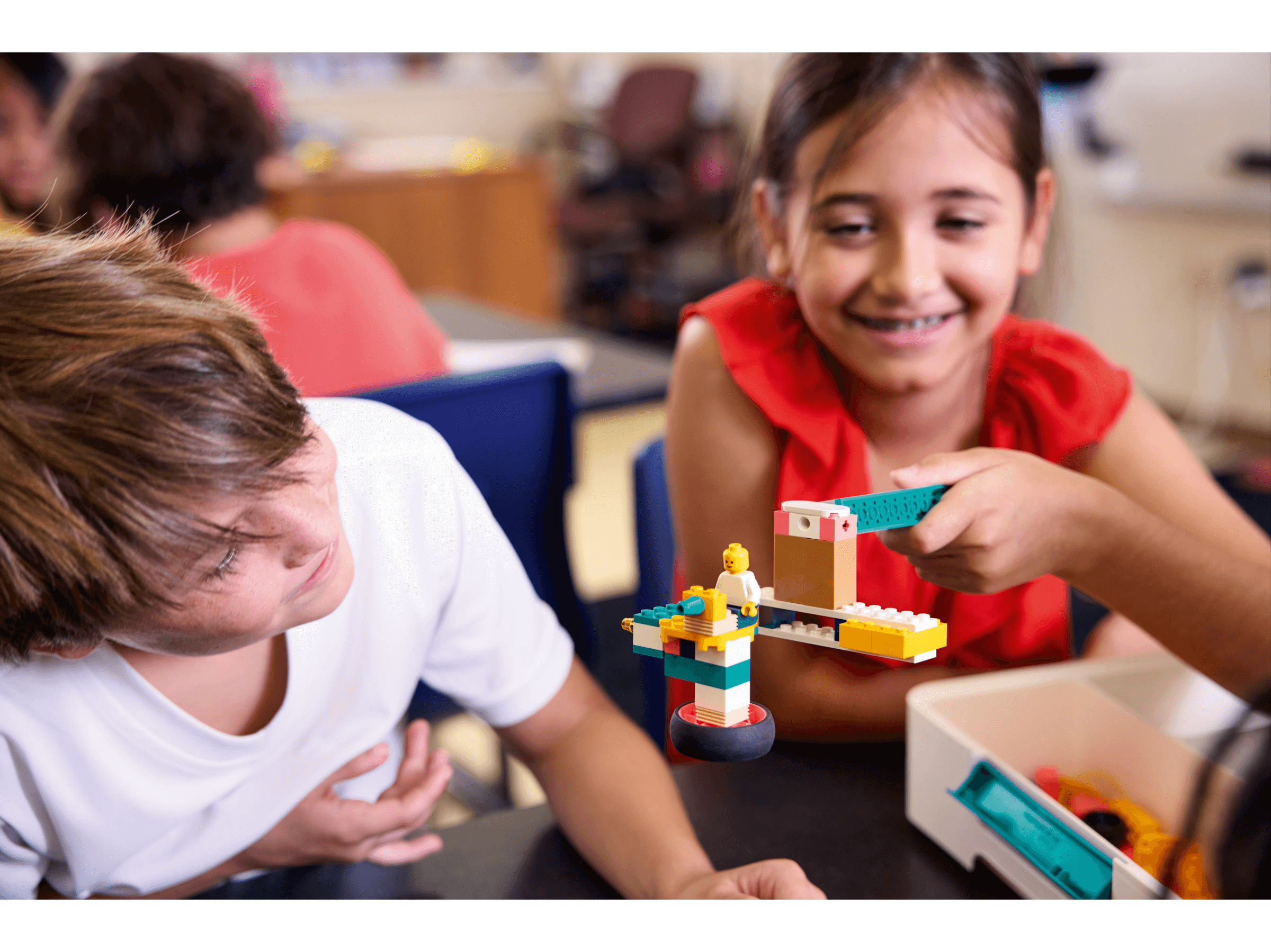 Children engaged with LEGO® Education Science kit, fostering hands-on learning and collaboration in the classroom.