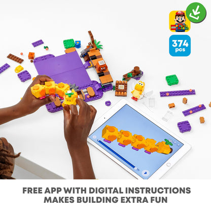 Child building with LEGO® Super Mario Poison Swamp Expansion Set using a digital app for guidance, highlighting creativity.