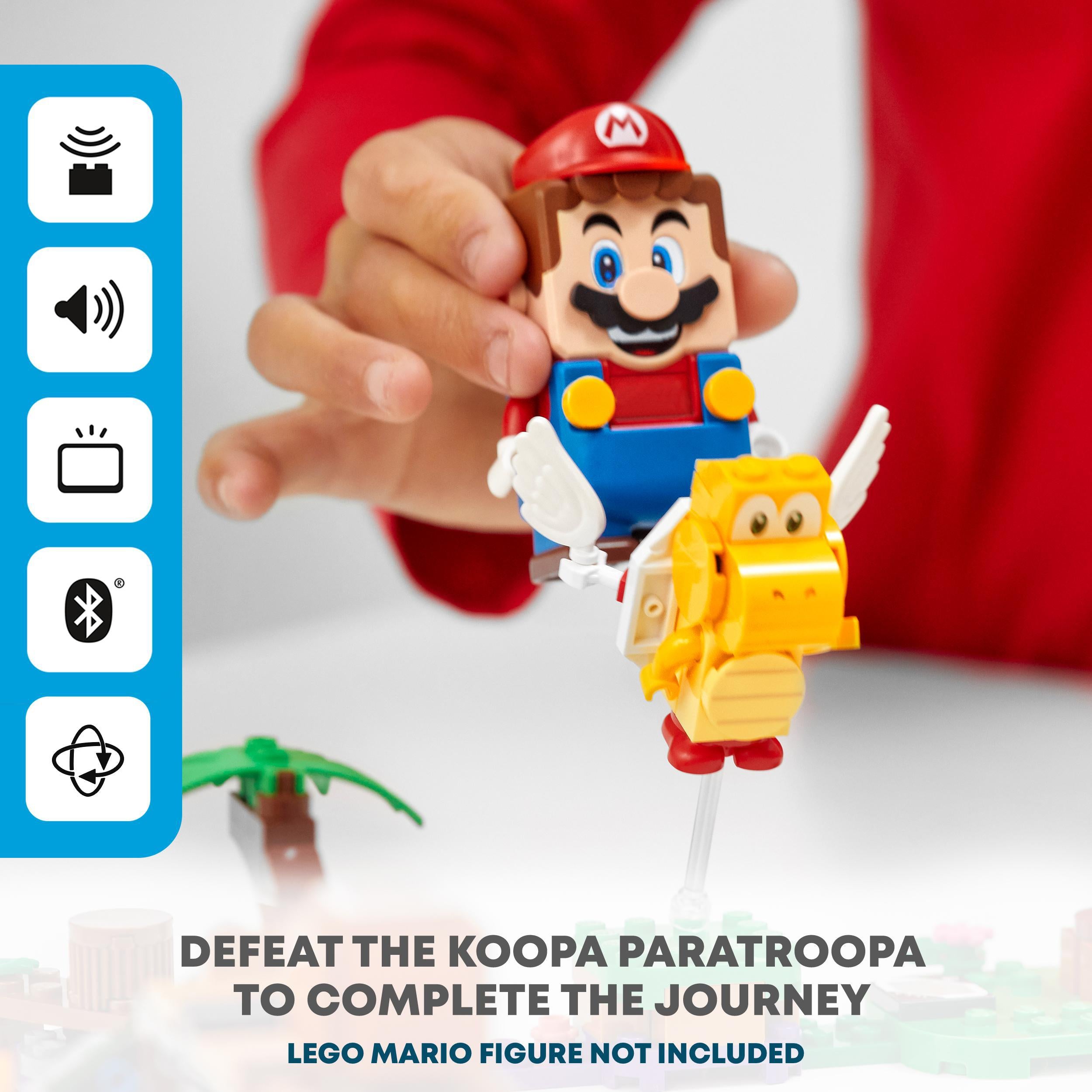 Child engaging with LEGO® Super Mario set, battling Koopa Paratroopa for an exciting Soda Jungle adventure.