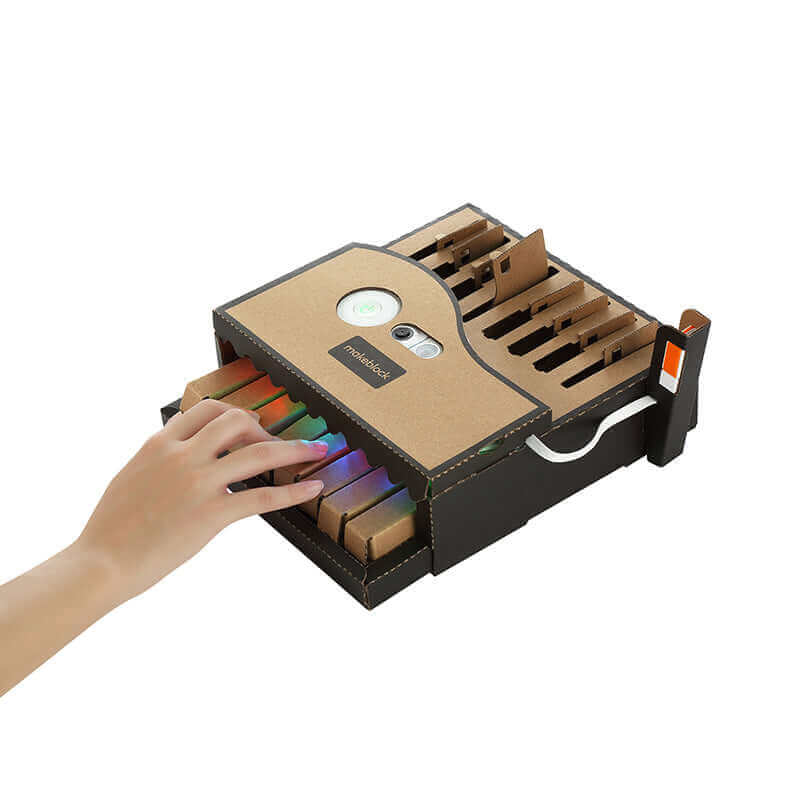 Makeblock Neuron Explorer Kit with colorful blocks and touch interface, ideal for interactive learning and creativity.