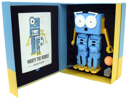 Marty the Robot kit with build guide, featuring a blue walking robot and components for coding education.