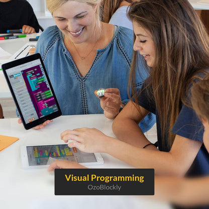 Students engaging in visual programming with Ozobot Evo for coding and robotics education.