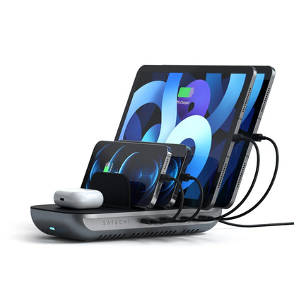 Satechi Dock5 Multi-Device Charging Station charging multiple devices with wireless pad and USB ports.