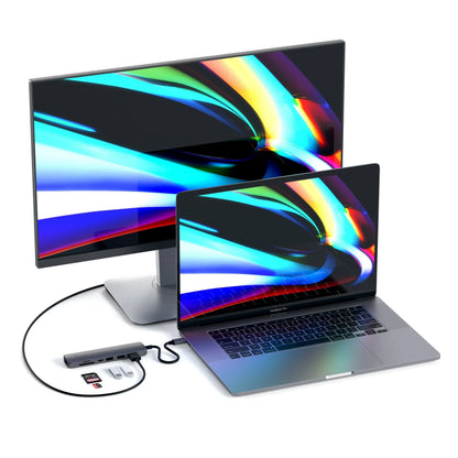 Satechi USB-C Slim Multi-Port with Ethernet Adapter connected to MacBook and external monitor.