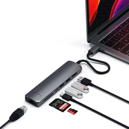 Satechi Type-C Slim Multiport Adapter connected to a MacBook with Ethernet, HDMI, and USB ports.