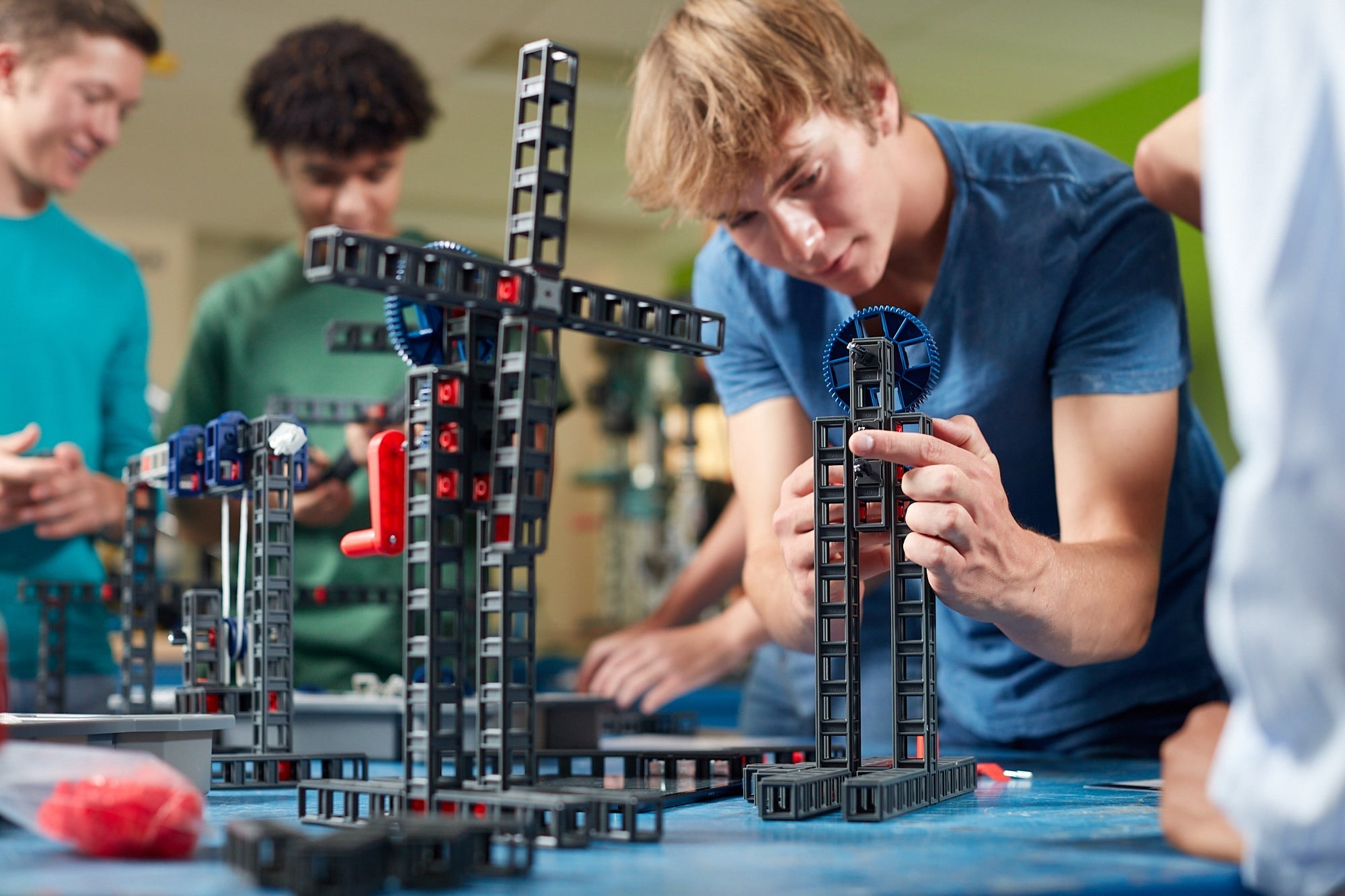 Students engaging in hands-on engineering with Sphero Blueprint Build Kit, constructing working prototypes in a classroom.