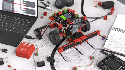 STEM Coding RoboMission robotics construction kit with components on a workspace, designed for World Robot Olympiad.